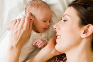 Mother playing with baby